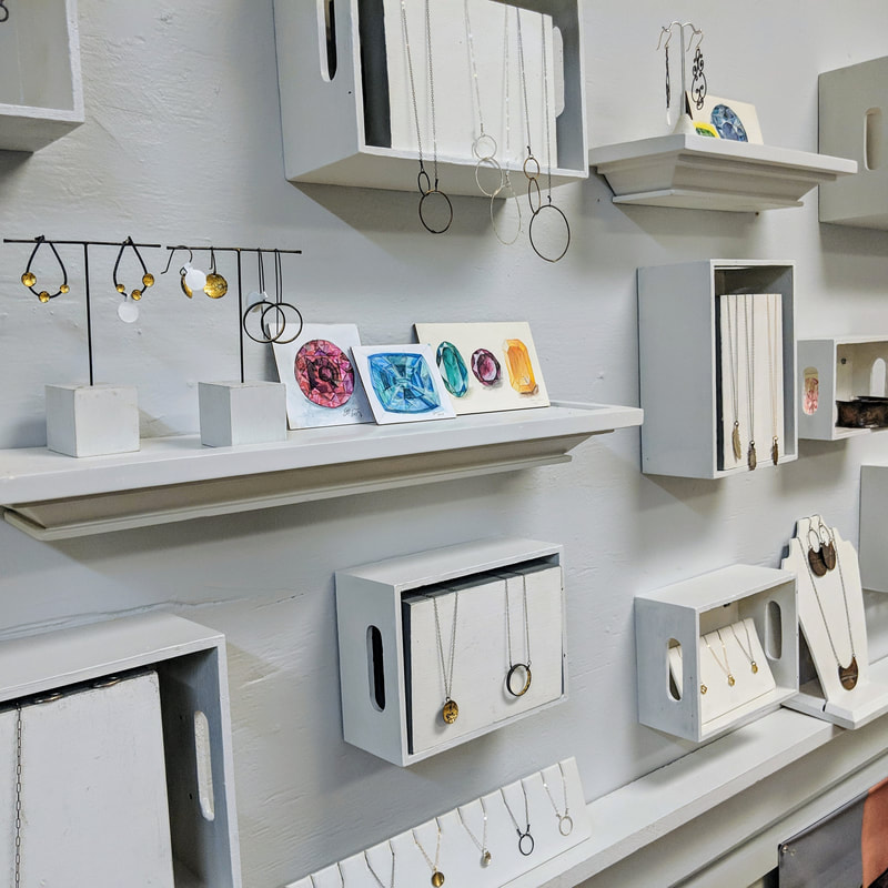 a wall display of jewelry
