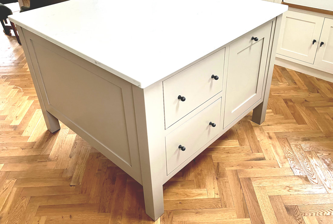 Elegant square kitchen island in Birdlip Gloucester with an integrated pull out bin and drawers