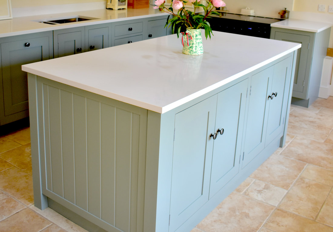 Handmade bespoke shaker panelled kitchen island in solid wood fitted in a kitchen in Cambridge 