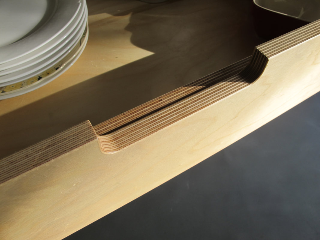 Contemporary modern bespoke formica laminated birch ply island with a stainless steel worktop in Saffron Walden Essex