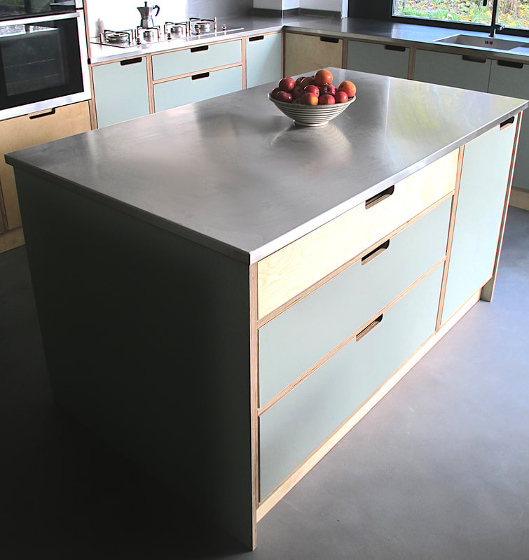 Contemporary modern bespoke formica laminated birch ply island with a stainless steel worktop in Saffron Walden Essex