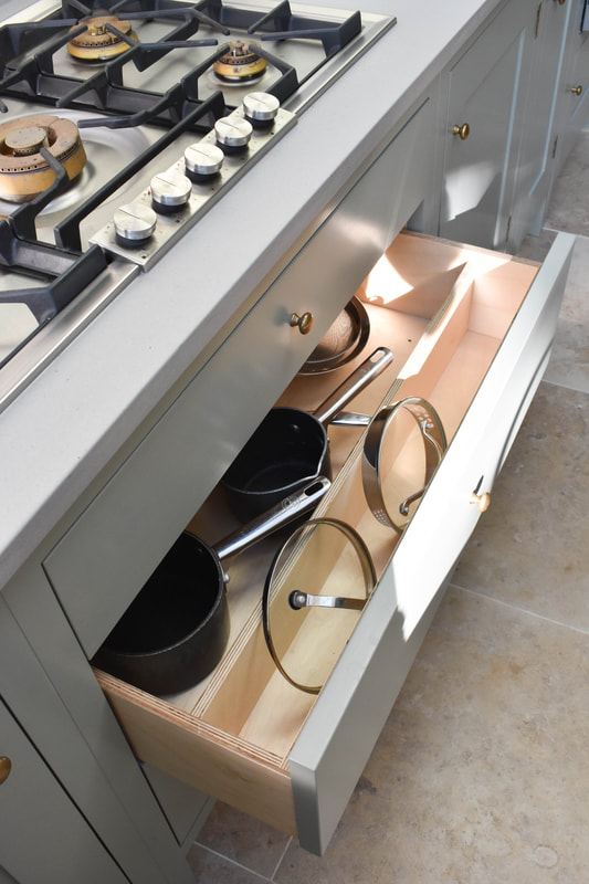 pan dividers in birch ply kitchen drawers in a kitchen in London