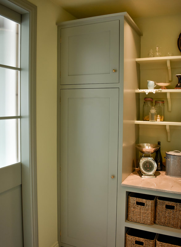 Sliding readed glass doors in bespoke handmade kitchen in North London