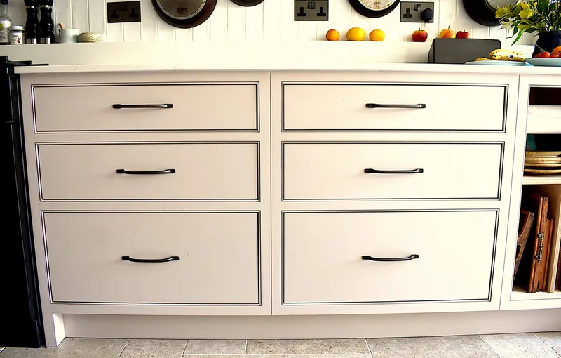 View of bespoke drawers showing beaded frames detail on a kitchen in North London