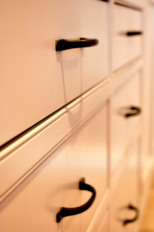 View of bespoke drawers showing beaded frames detail on a kitchen in North London