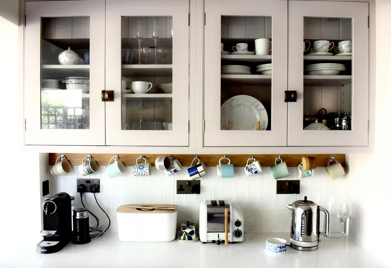 Beautiful glazed wall cabinets with tongue and groove backs on a modern shaker kitchen North London