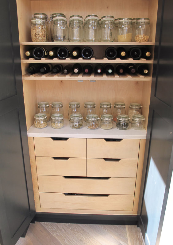 Contemporary shaker panelled framed kitchen in North London with birch ply interiors. Sprayed handmade kitchen island with soft close drawers 