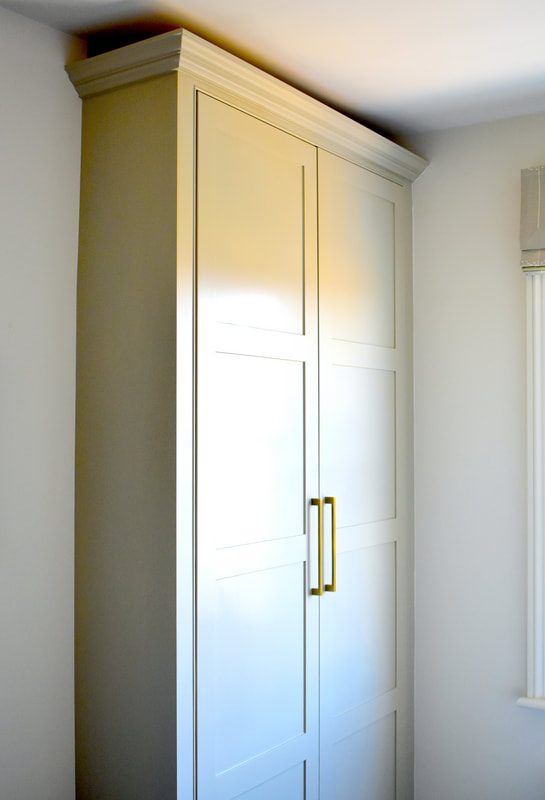 Elegant panelled door 2 wardrobe with interior drawers  in North London