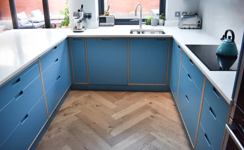 Sprayed contemporary handmade kitchen in Cround End North London. Birch ply drawers and doors