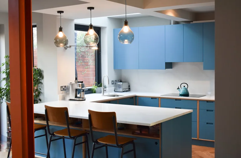 Sprayed contemporary handmade kitchen in Cround End North London. Birch ply drawers and doors