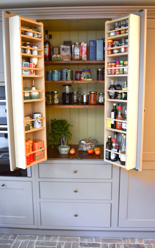 bespoke larder with spice racks and made in reclaimed and painted timber 