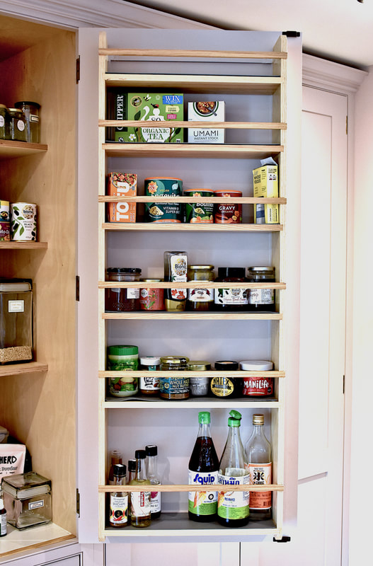 Birch ply door mounted shelving on a pantry in solid wood kitchen North London