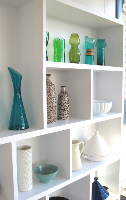 Bespoke shelving in contemporary studio living space North London