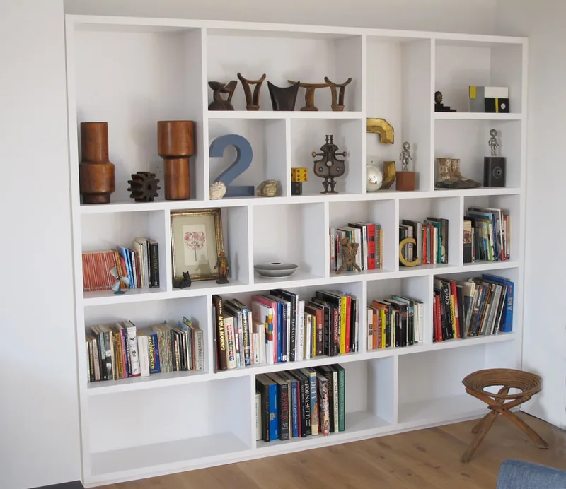Bespoke shelving in contemporary studio living space North London