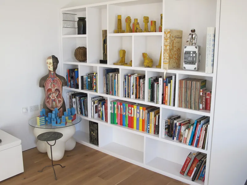 Bespoke shelving in contemporary studio living space North London