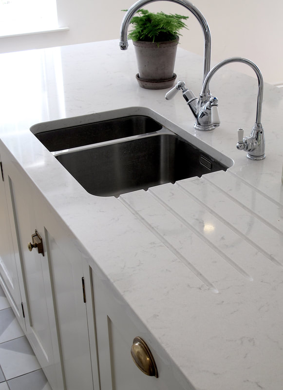 Undermount sink in Bespoke shaker framed kitchen in Islington North London. Soft close birch ply drawers. Hand painted solid timber kitchen island . 