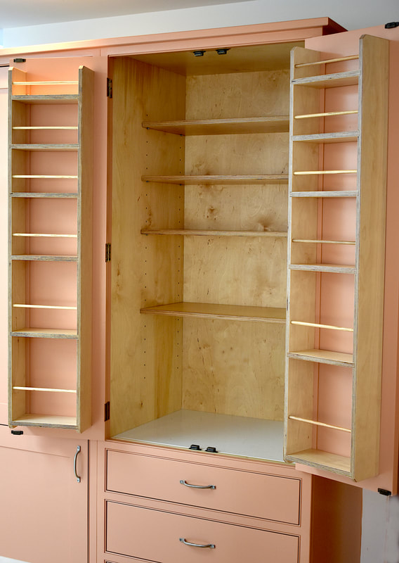 Birch ply door mounted shelving in a larder cabinet North London