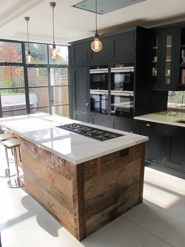 Painted bespoke kitchen in Muswell Hill North London. Solid timber panelled shaker doors and reclaimed timber island.
