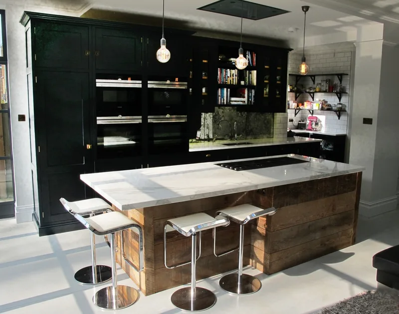 Painted bespoke kitchen in Muswell Hill North London. Solid timber panelled shaker doors and reclaimed timber island.