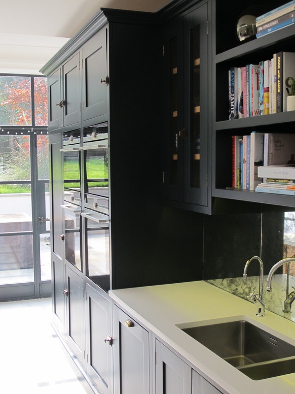 Painted bespoke kitchen in Muswell Hill North London. Solid timber panelled shaker doors and reclaimed timber island.
