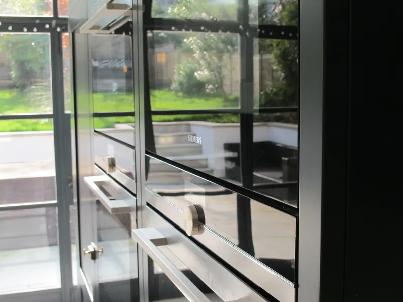 Painted bespoke kitchen in Muswell Hill North London. Solid timber panelled shaker doors and reclaimed timber island.