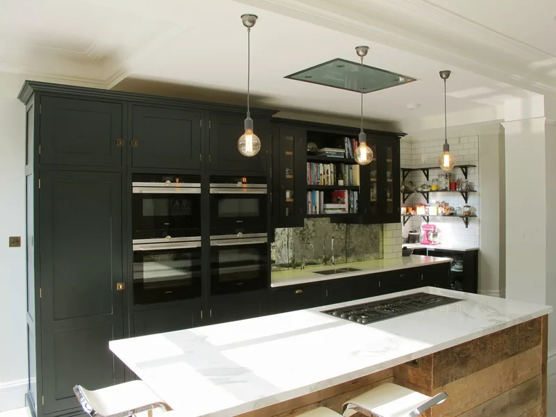 Painted bespoke kitchen in Muswell Hill North London. Solid timber panelled shaker doors and reclaimed timber island.