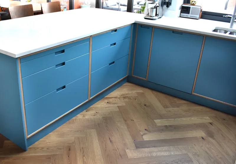 Sprayed contemporary handmade kitchen in Cround End North London. Birch ply drawers and doors