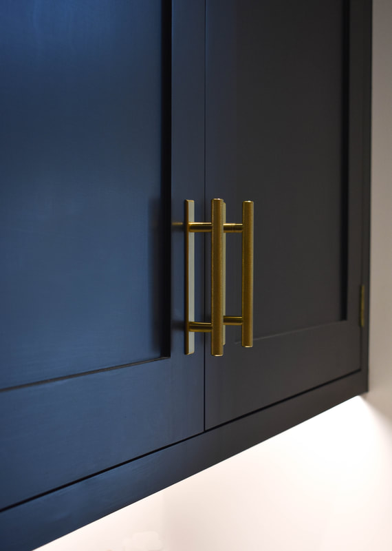 antique brass pulls on mixed solid hand painted timber and reclaimed wood kitchen in a new extension in Hertfordshire 