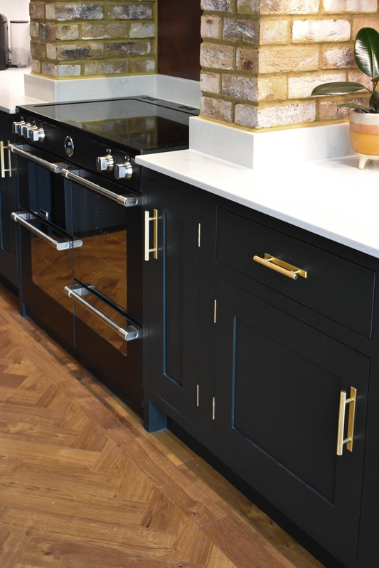 Mixed solid hand painted timber and reclaimed wood kitchen in a new extension in Hertfordshire 