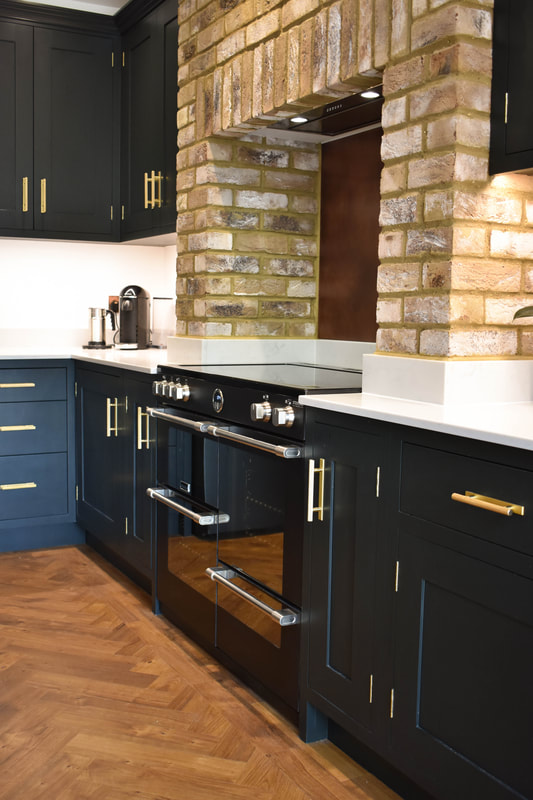 Mixed solid painted timber and reclaimed wood kitchen in a new extension in Hertfordshire 