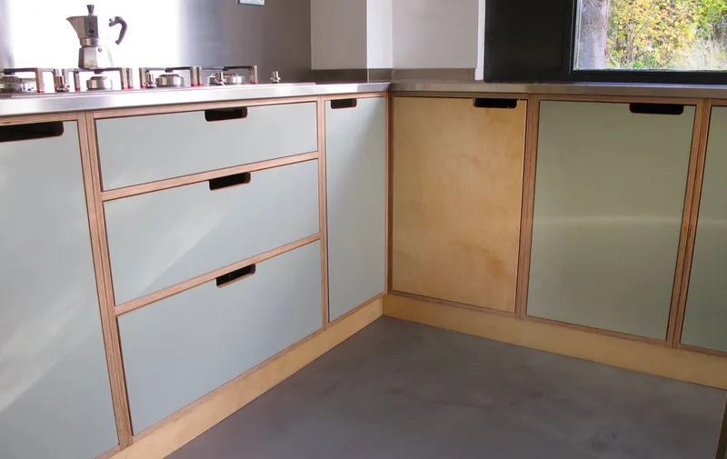 Contemporary formica laminated birch ply kitchen in Saffron Walden Esex with a stainless steel worktop