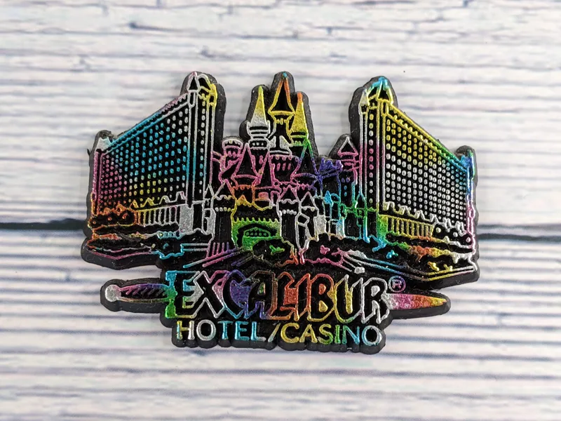 A magnet with metallic colors depicting the Excalibur Hotel and Casino. 