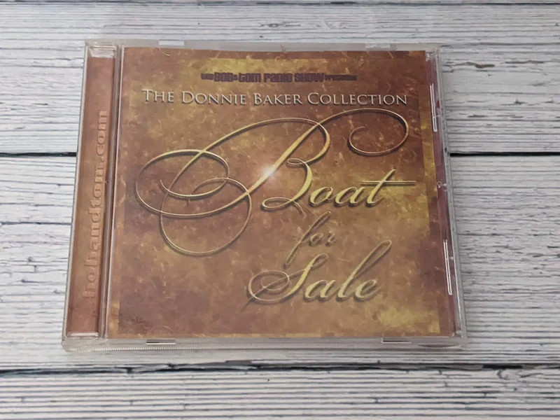 Boat for Sale CD in a plastic CD case with a brown paper insert.