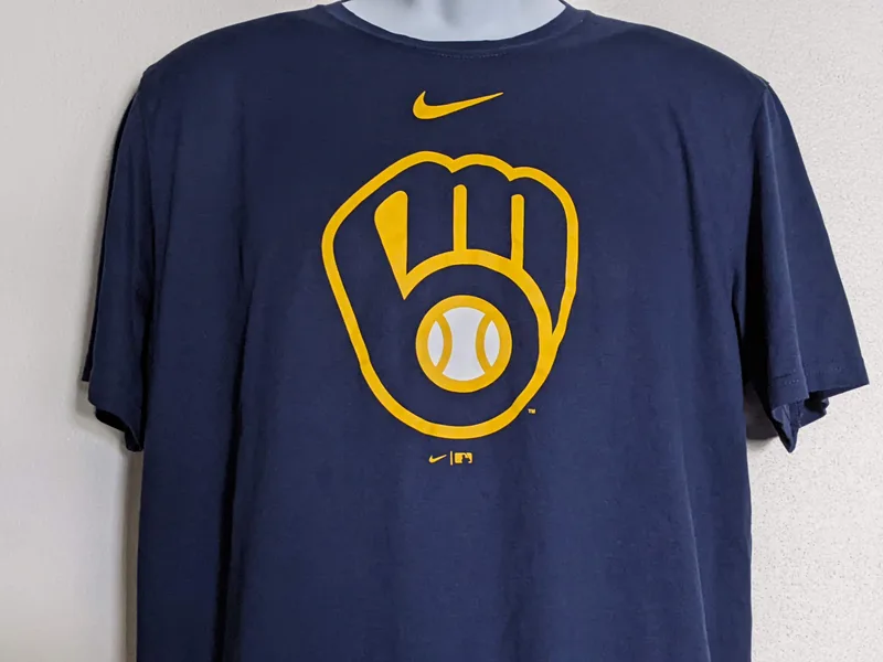 A navy blue t-shirt with a contemporary MLB logo of the Milwaukee Brewers.