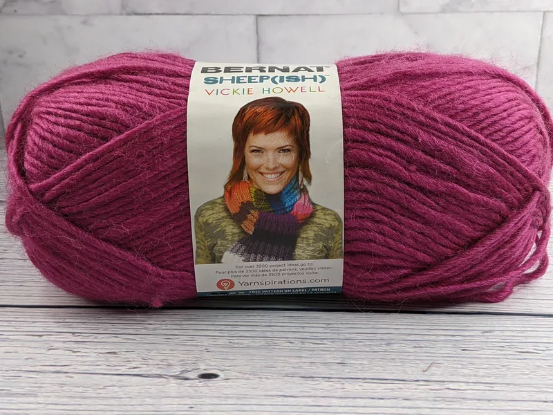 Raspberry purple skein of yarn by Bernat sheepish.