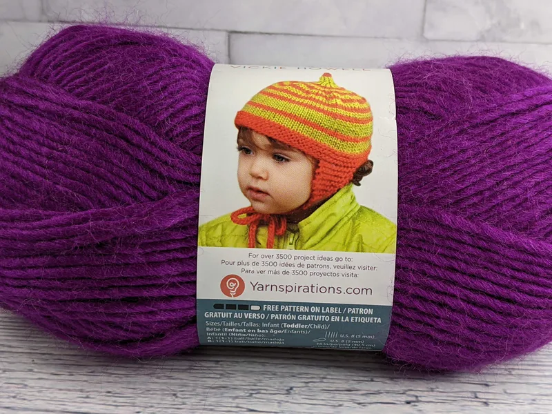 A purple skein of yarn by Bernat.
