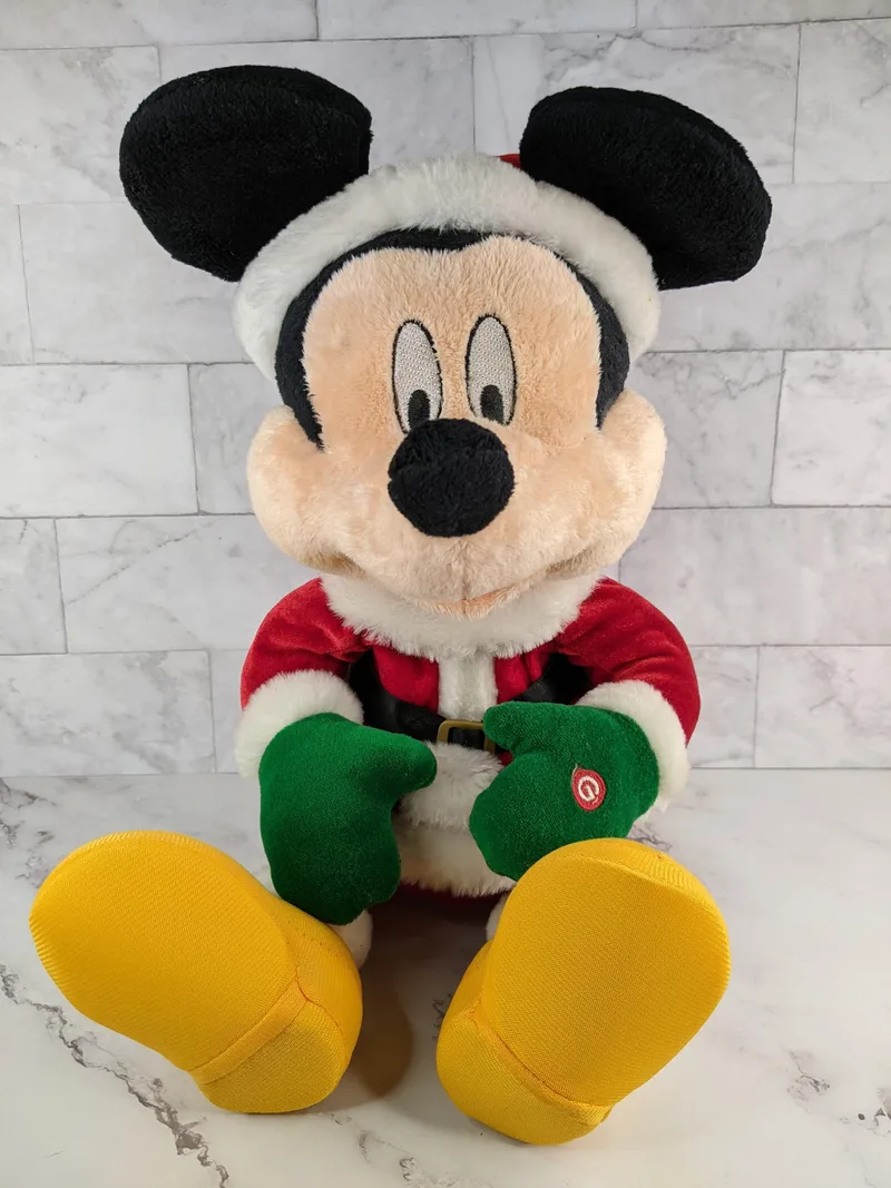 A plush Micky Mouse Santa doll that moves and sings Deck the Halls.