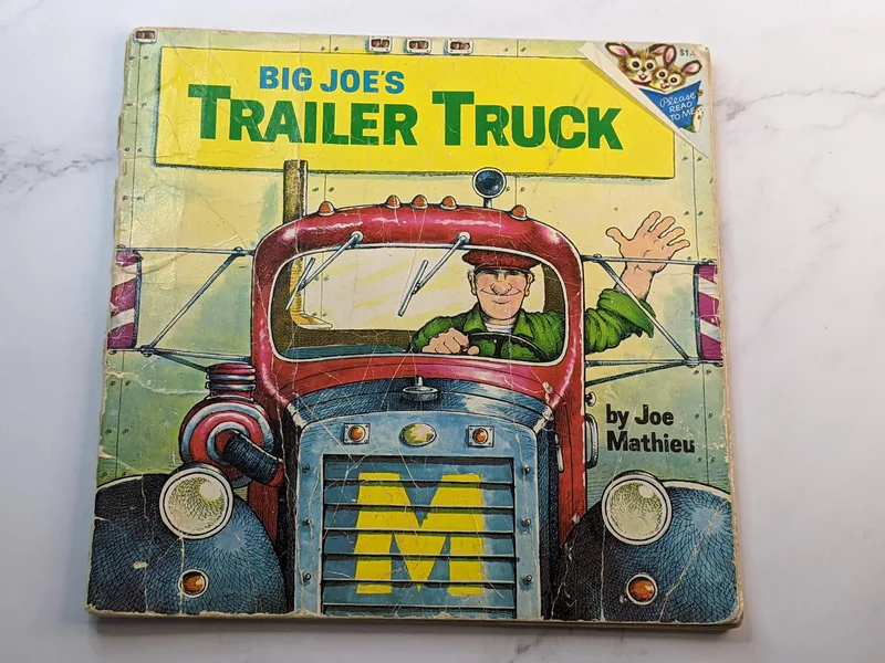 A children's paperback story book titled Big Joe's Trailer Truck, with the cover featuring an image of a man in a red semi-truck.