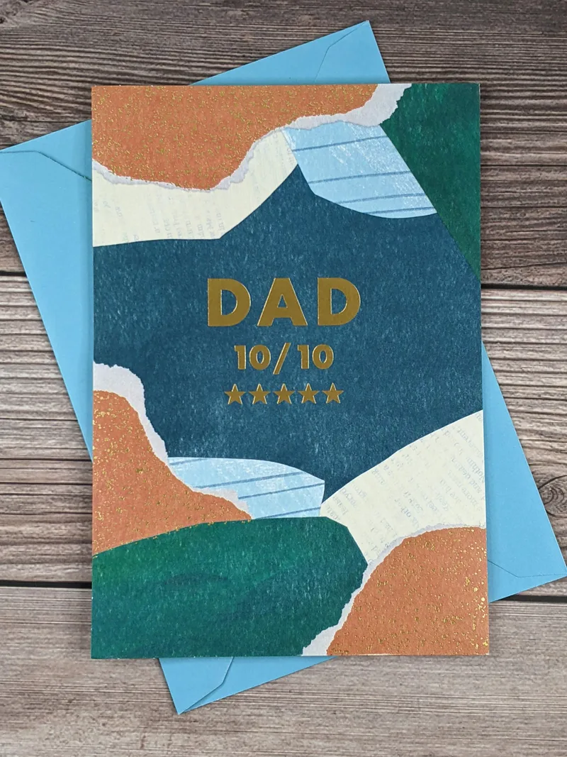 A Father's Day greeting card with random shapes on the cover in teal, cream and copper colors.