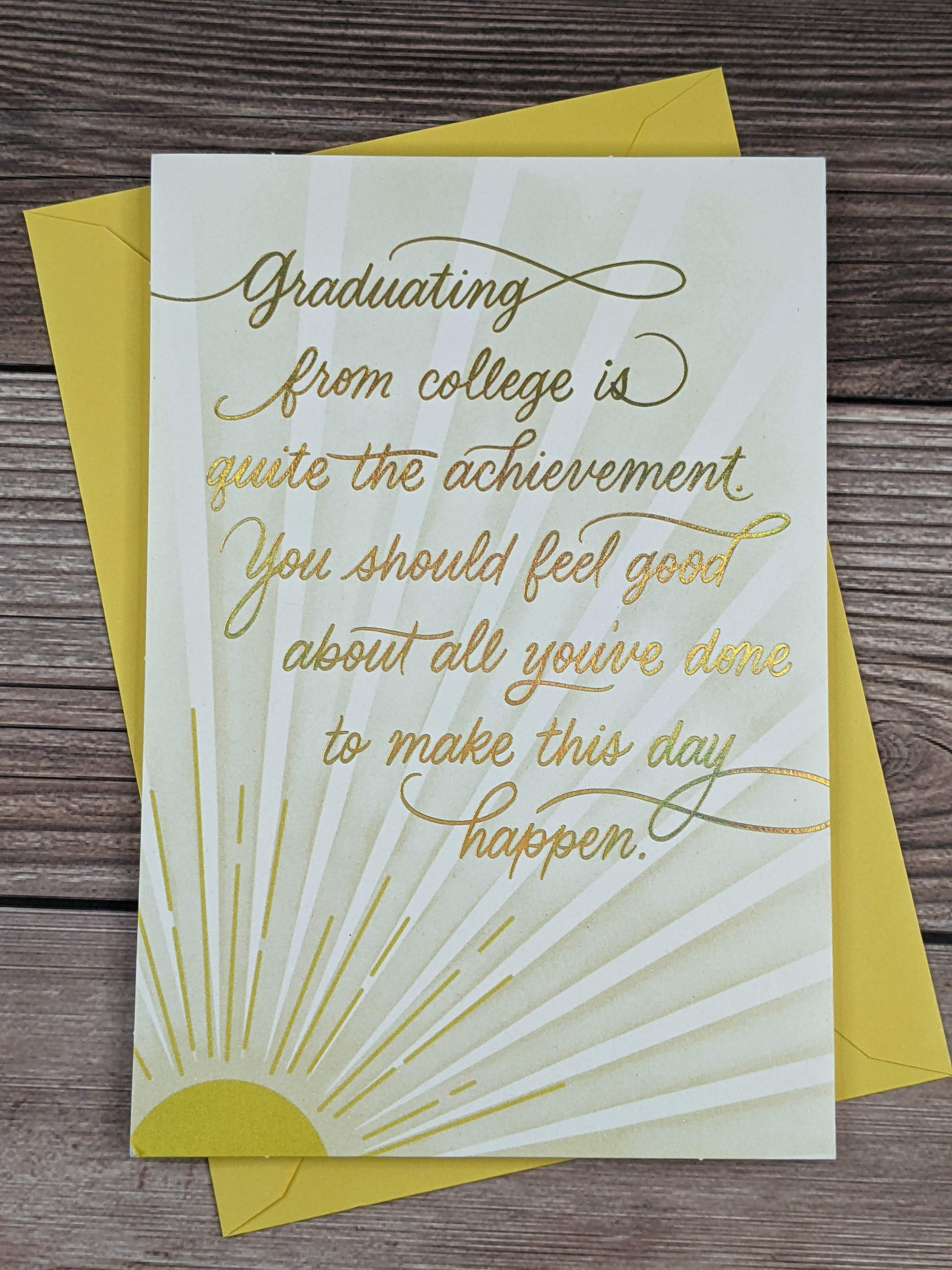 A Hallmark graduation greeting card for a college grad, with an image of a yellow sunshine on the front cover.