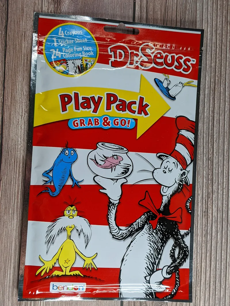 A pack of Dr. Seuss themed activities with a 24-page small coloring book, 4 crayons, and a sheet of stickers.