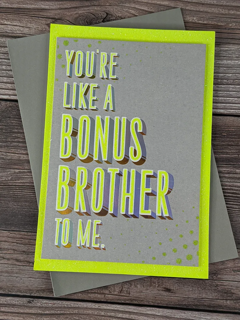 A gray birthday greeting card for a brother-in-law with neon yellow glittery accents and the words "You're like a bonus brother to me."