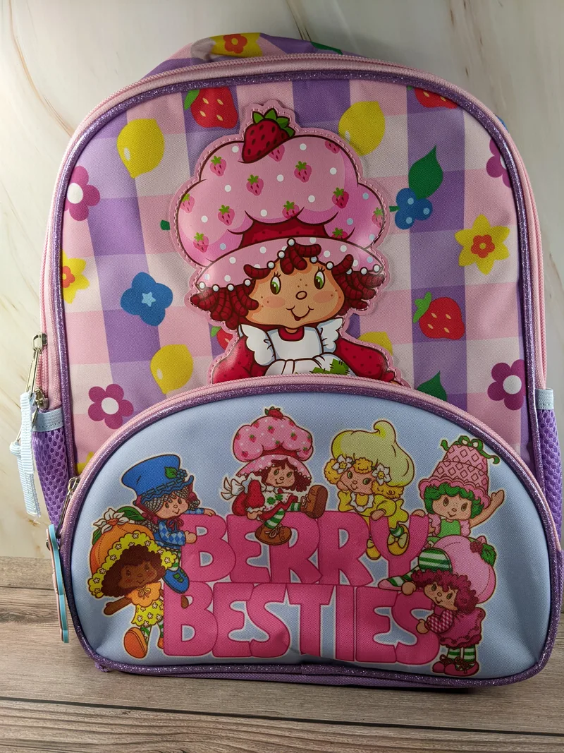A purple and pink Strawberry Shortcake backpack.