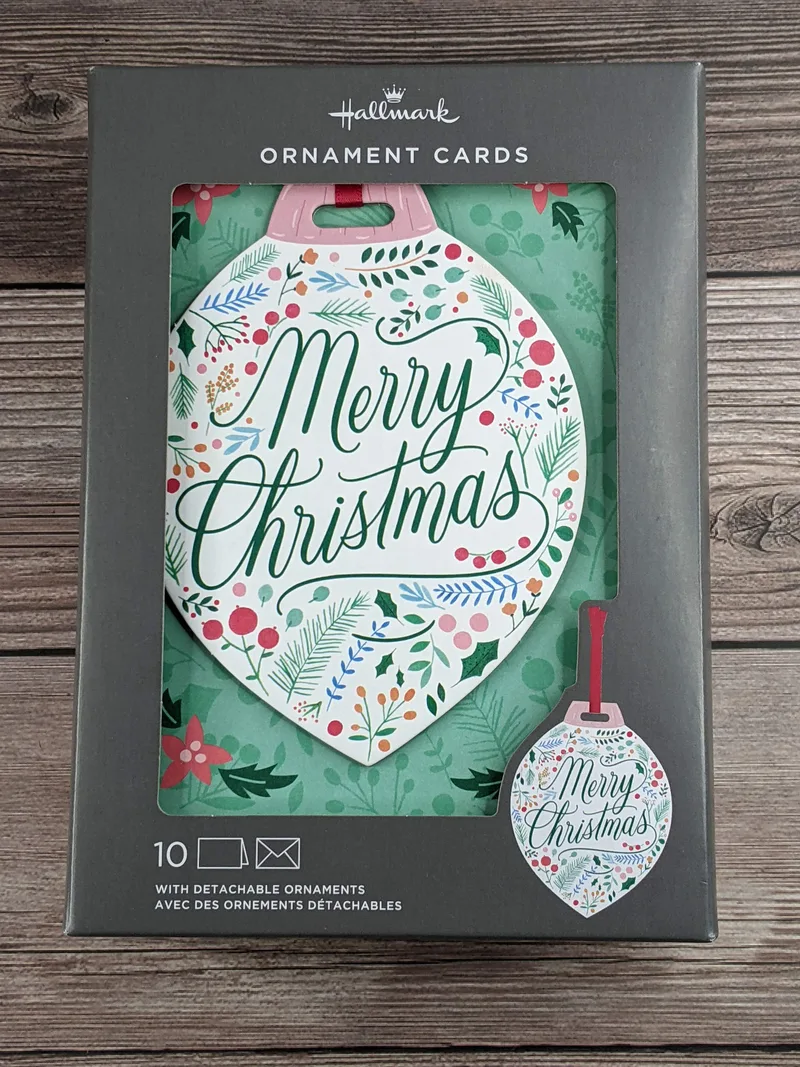 A Hallmark set of boxed Christmas cards with a detachable ornament.