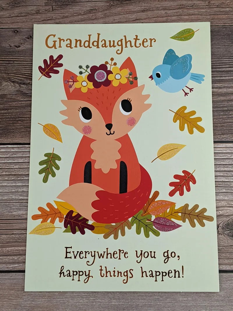 A thanksgiving card for a granddaughter with an image of a fox and bird with leaves.