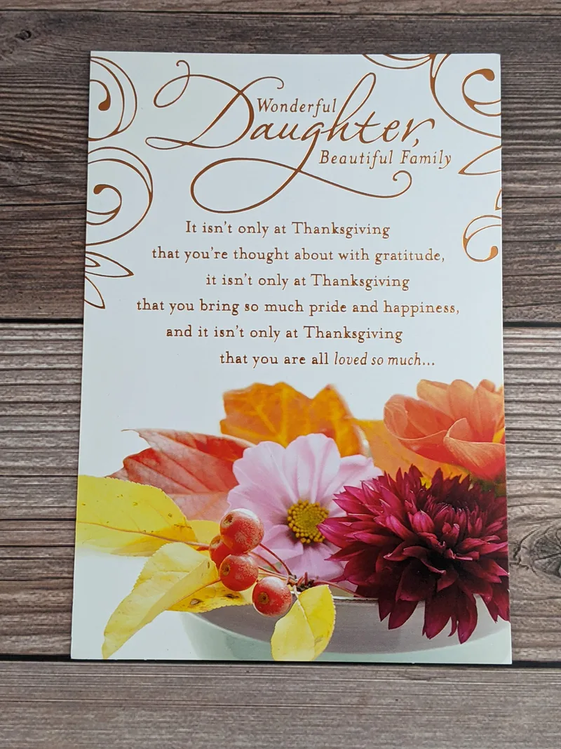 A thanksgiving card for a daughter and her family with images of flowers.