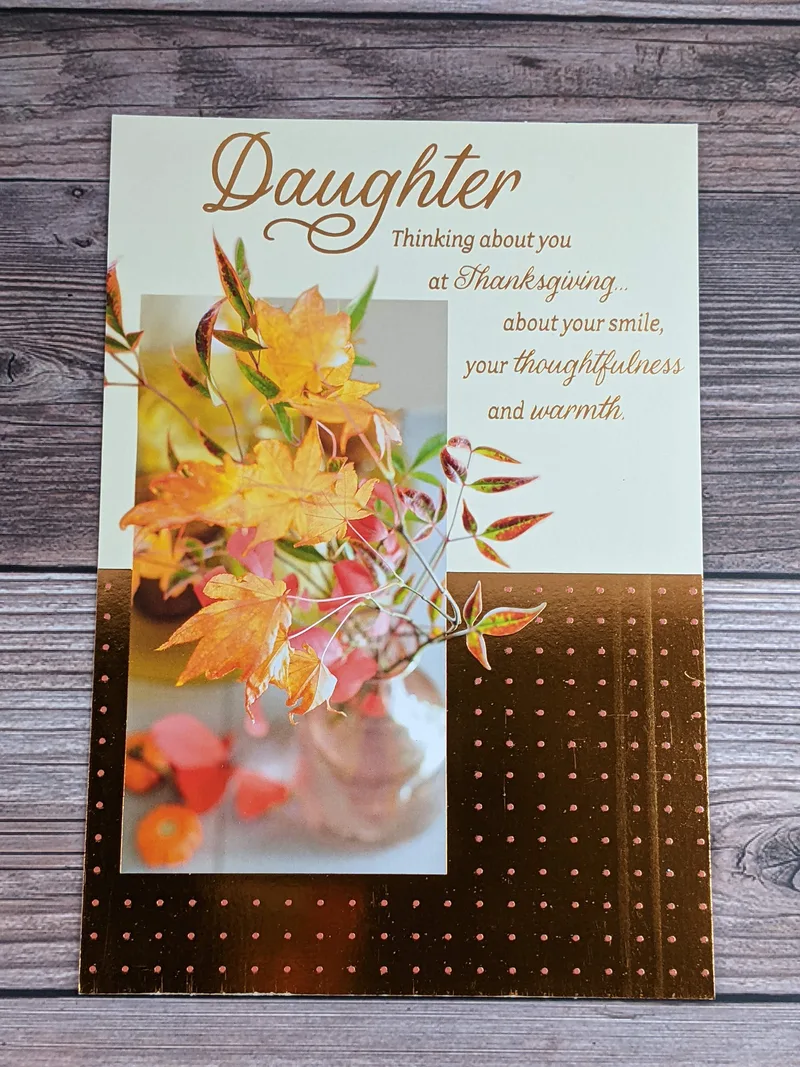 A Thanksgiving card for a daughter with metallic accents and an image of colorful leaves.