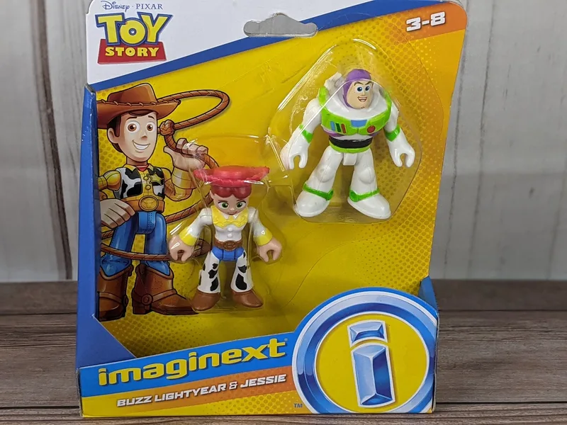 A package of 2 Toy Story figurines, Buzz Lightyear and Jessie.