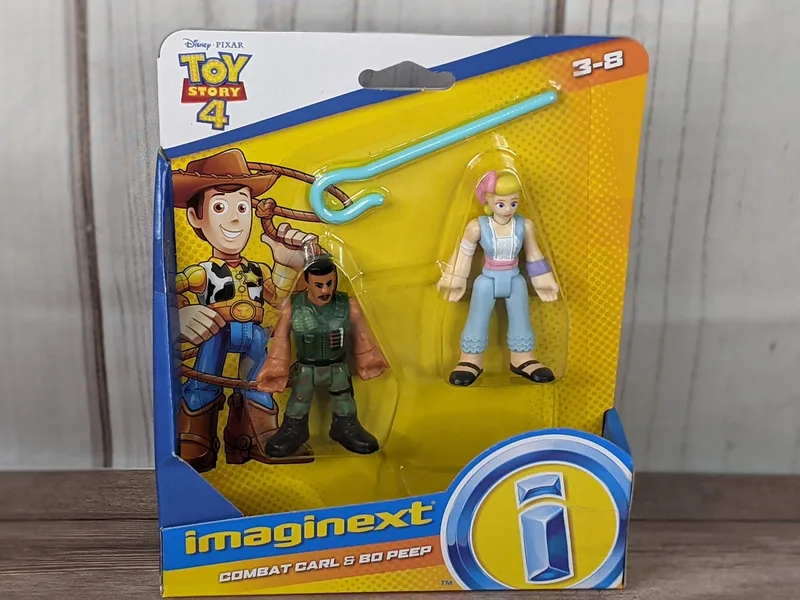 A package of 2 Toy Story figurines, Combat Carl and Bo Peep.