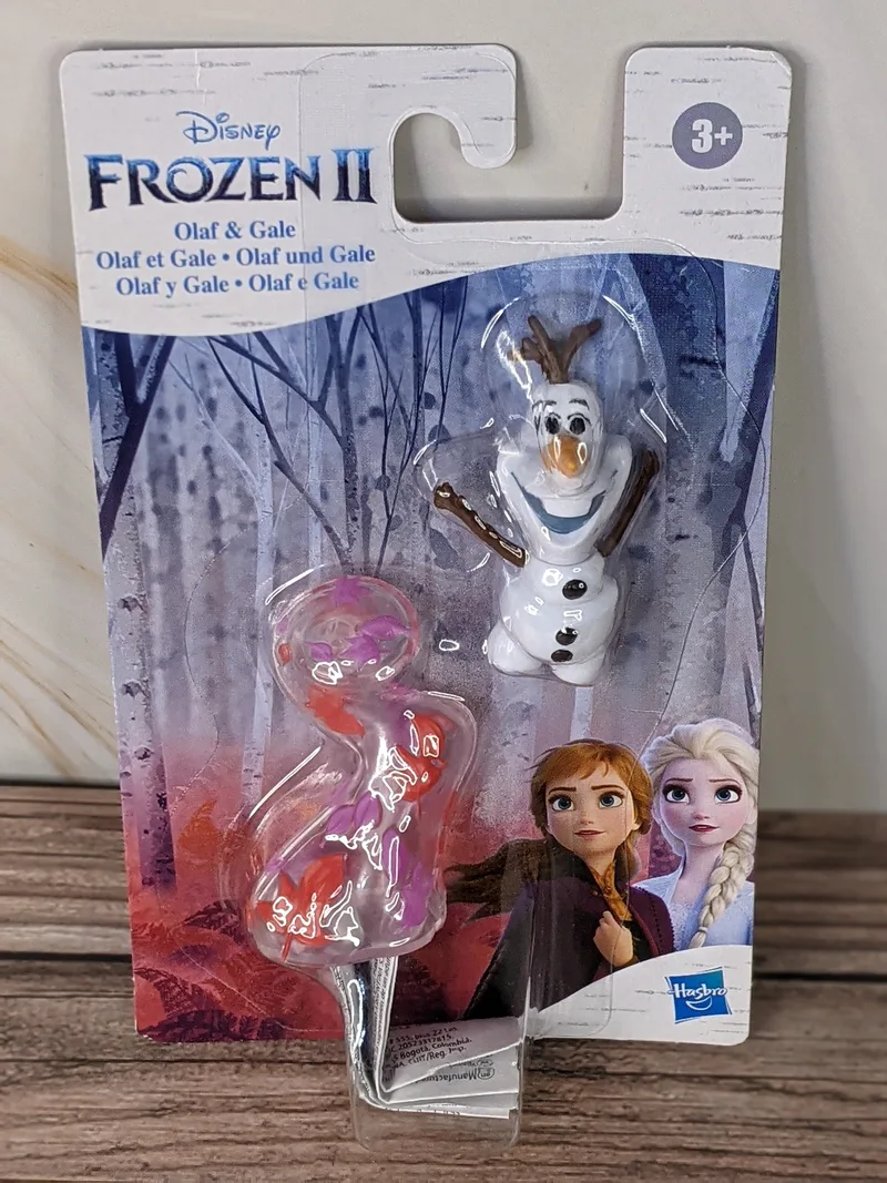Disney Frozen movie character figures of Olaf and Gale in a product package.